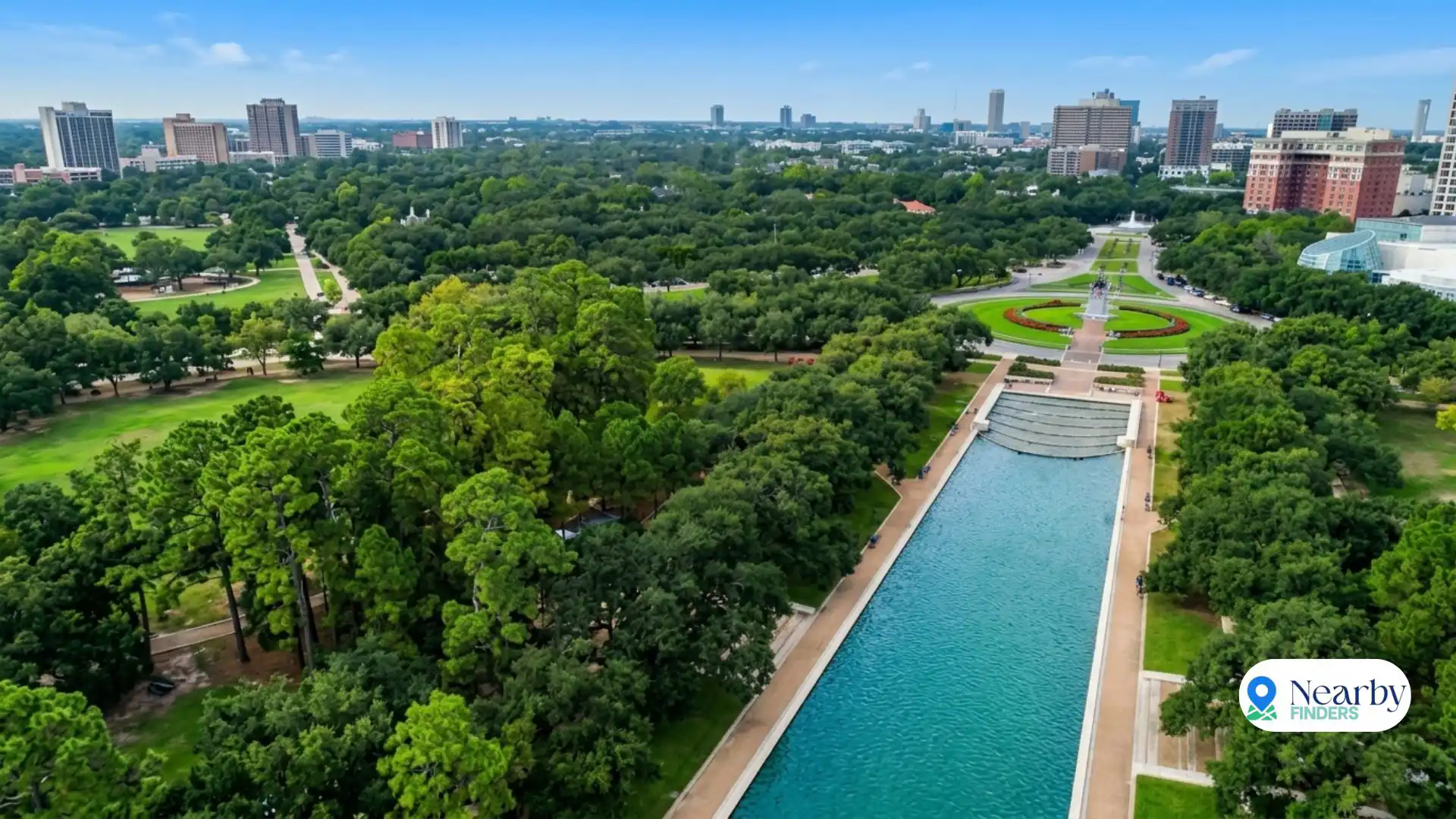 Hermann Park Houston free Japanese Garden reflection pool: A peaceful couple walking along the lush green trails and scenic outdoor paths near the water during early morning