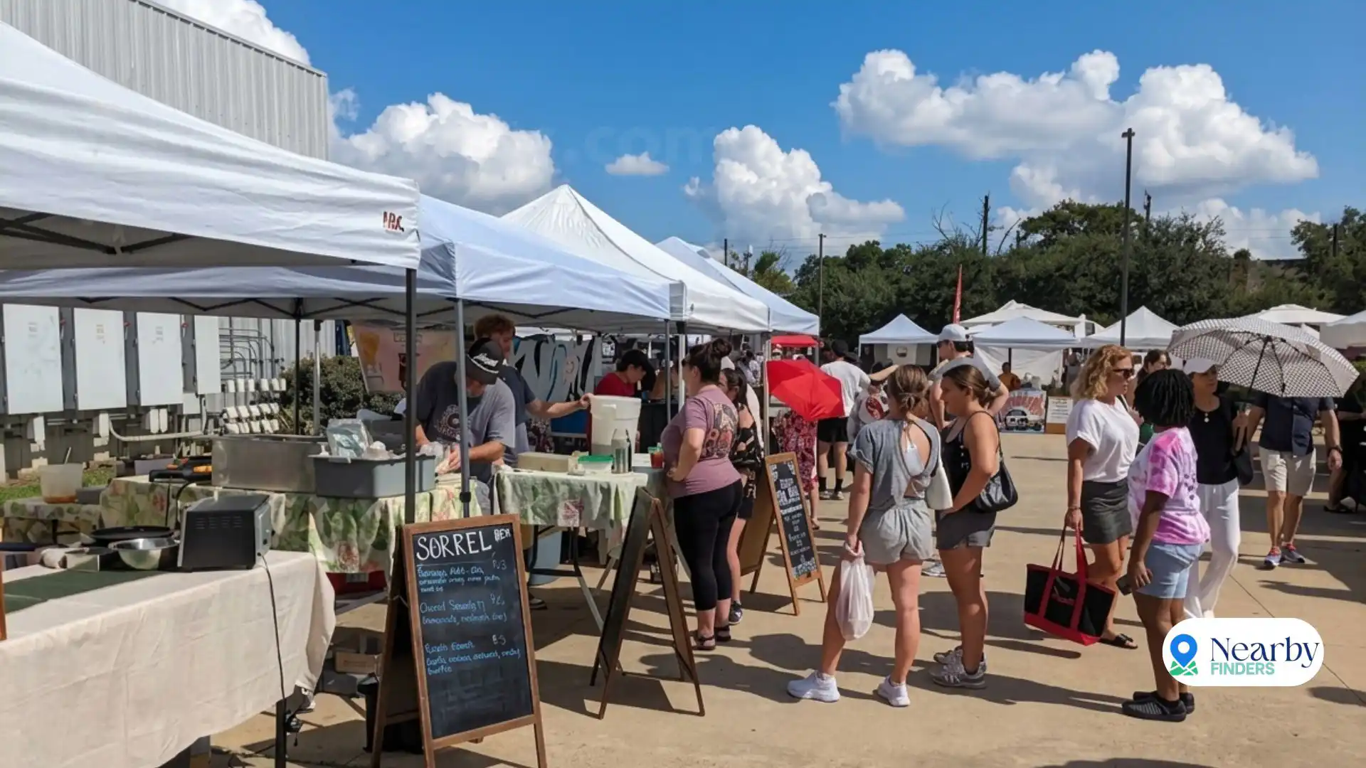Urban Harvest Farmers Market Houston free weekend food: Local residents and foodies browsing outdoor vendor stalls and tents under a blue sky on a Saturday morning